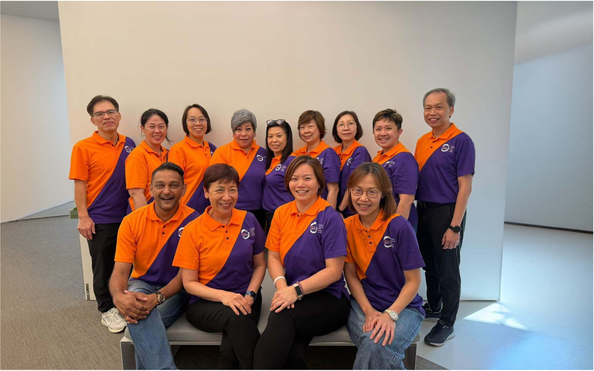 Brahm Centre team members wearing orange and purple Brahm Centre shirts